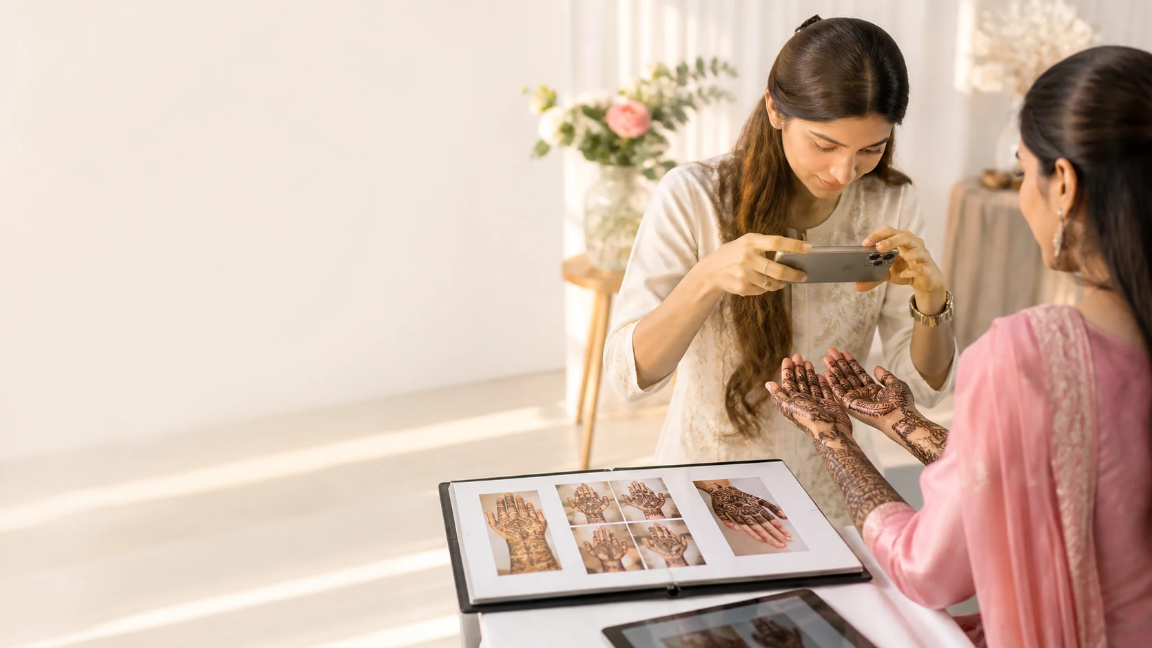 Mehndi artist photographing an original finished design for her professional portfolio
